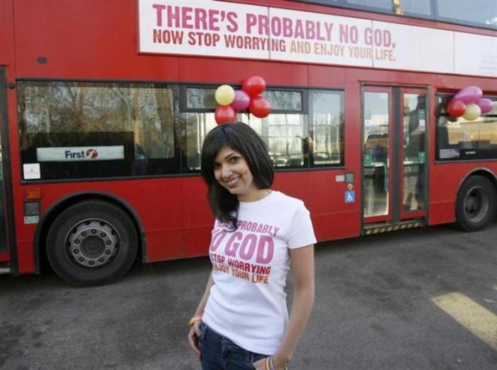 Atheist Bus Campaign creator Ariane Sherine poses for photographers in front of a bus bearing an atheist advertisement, at the launch of the campaign, in London January 6, 2009.