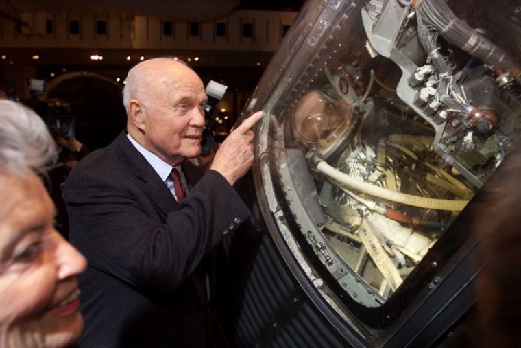 Former astronaut John Glenn shows the interior of his 'Friendship 7' Mercury spacecraft to wife Annie at the Smithsonian Air and Space Museum in Washington, DC, U.S. on February 20, 2002. Exactly 40 years ago, Glenn became the first American to orbit the Earth in this spacecraft. Glenn is one of America's seven original astronauts. Located in the 'Milestones of Flight' gallery, the capsule is one of the museum's most popular attractions.