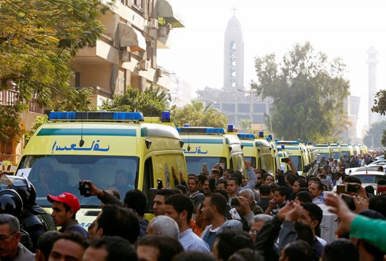 Egyptian Christians shout slogans as ambulances transport the bodies of victims killed in the bombing of Cairo's main Coptic cathedral after the funeral, in Cairo, Egypt, December 12, 2016.