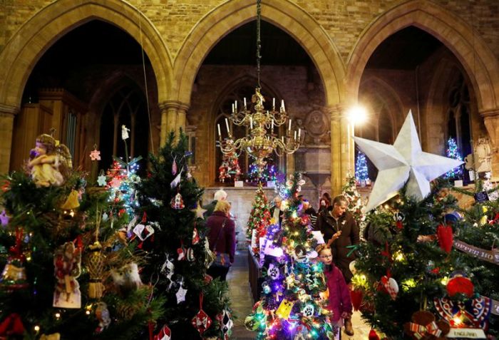 Visitors look around the Christmas Tree Festival at St Mary's Parish Church in Melton Mowbray, Britain, December 5, 2016.