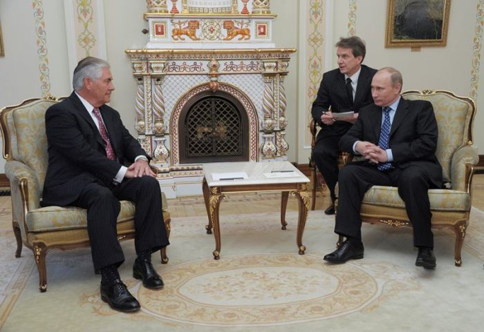 Then Russian Prime Minister Vladimir Putin and Exxon Mobil Chief Executive Rex Tillerson attend a meeting at the Novo-Ogaryovo state residence outside Moscow, Russia April 16, 2012. Picture taken April 16, 2012.
