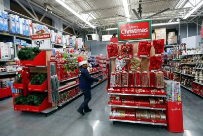 An employee checks on a Christmas display at a Walmart store in Chicago, Illinois, November 23, 2016.