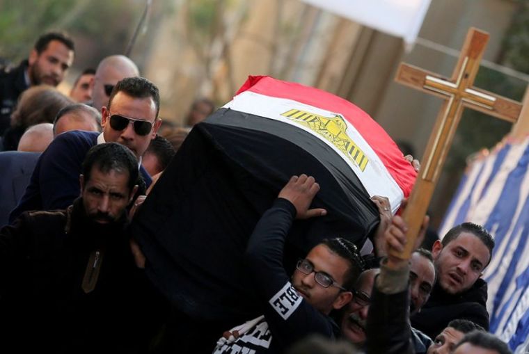 Relatives of Nabiel Habieb, a Christian man who was killed in the bombing of Cairo's main Coptic cathedral, carry his body to bury him at the Mokattam Cemetery in Cairo, Egypt, December 12, 2016.