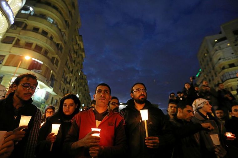 Egyptian Muslims and Christians hold lighted candles in downtown Cairo, following a deadly explosion inside a Coptic cathedral in Cairo, Egypt, December 14, 2016.