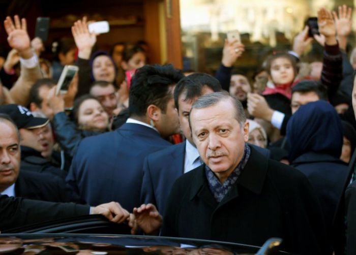 Turkish President Tayyip Erdogan leaves Eyup Sultan mosque in Istanbul, Turkey, December 11, 2016.