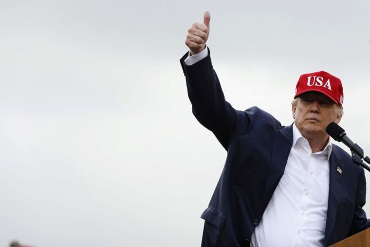 U.S. President-elect Donald Trump gestures as he speaks during a USA Thank You Tour event in Mobile, Alabama, December 17, 2016.