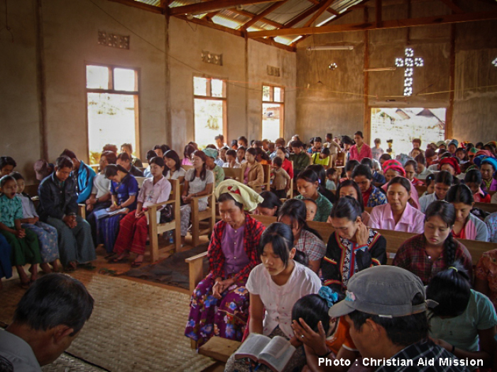An indigenous missionary preaches the good news of Christ to villagers in Burma (Myanmar) in this undated photo.
