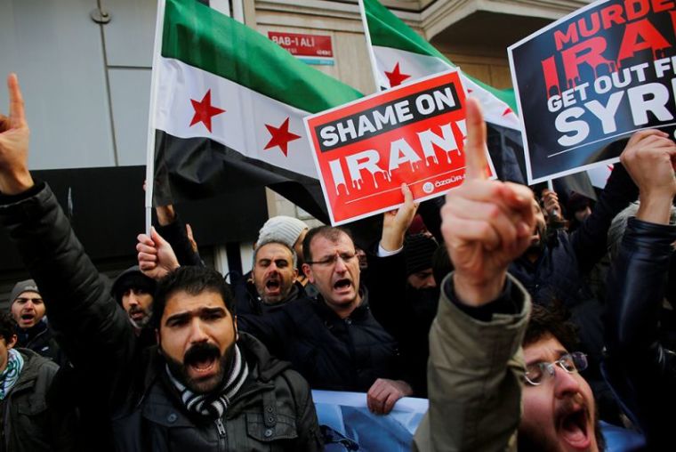 Demonstrators shout slogans during a protest against Iran's role in Aleppo, near the Iranian Consulate in Istanbul, Turkey, December 16, 2016.