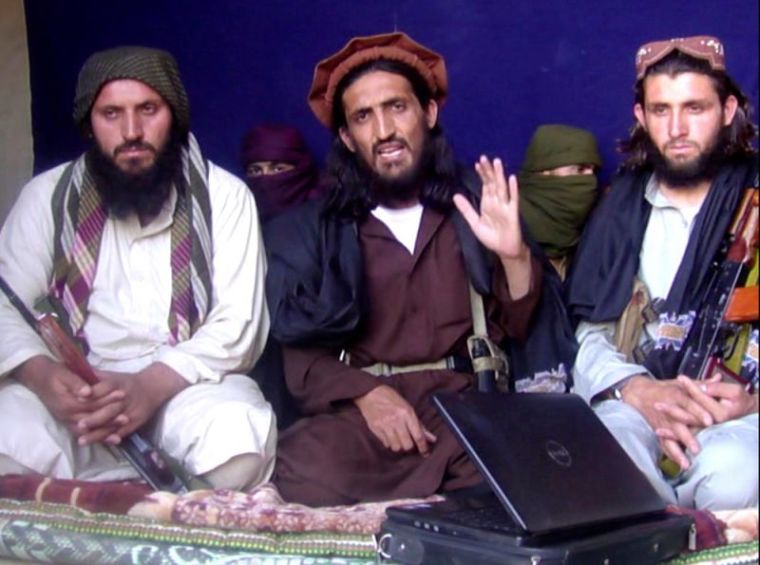 In this file image taken from a video recording, Omar Khalid Khorasani (C), a top Pakistan Taliban commander, gives an interview in Pakistan's Mohmand tribal region on June 2, 2011. General Asim Bajwa, director general of the Pakistani army's media division, reported the death of Umar Narai, also known as Khalifa Umar Mansoor or Khalid Khurasani, in a message on Twitter on July 13, 2016.