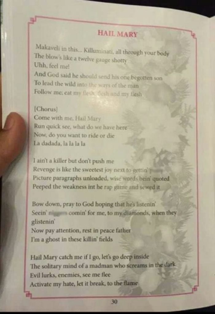 Tupac lyrics on Christmas carols sheet.