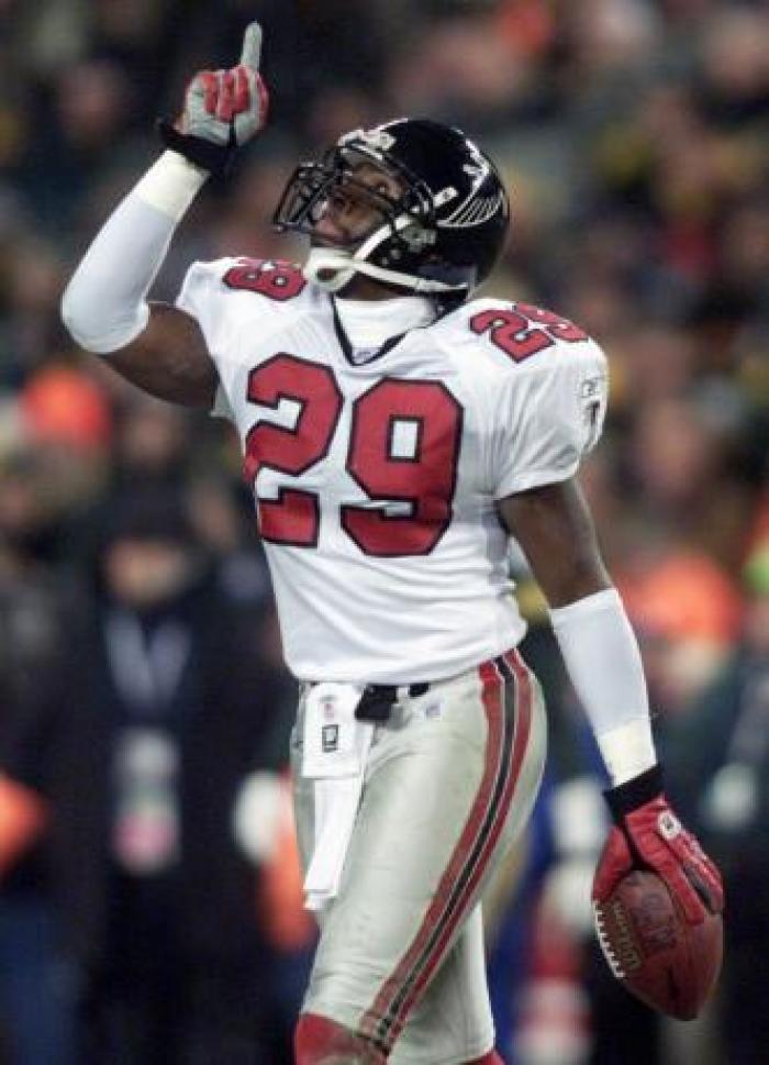 Atlanta Falcons Keion Carpenter celebrates an interception against theGreen Bay Packers and quarterback Brett Favre during first quarteraction of the NFC wild card game at Lambeau Field in Green Bay,Wisconsin January 4, 2003.