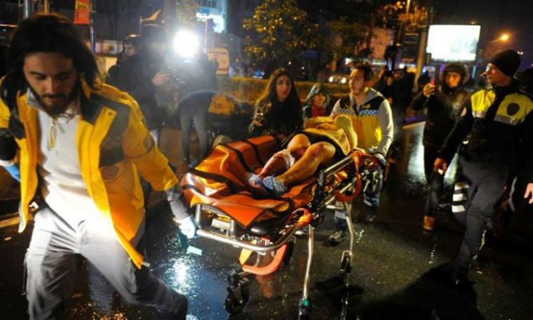 An injured woman is carried to an ambulance from a nightclub where a gun attack took place during a New Year party in Istanbul, Turkey, January 1, 2017.