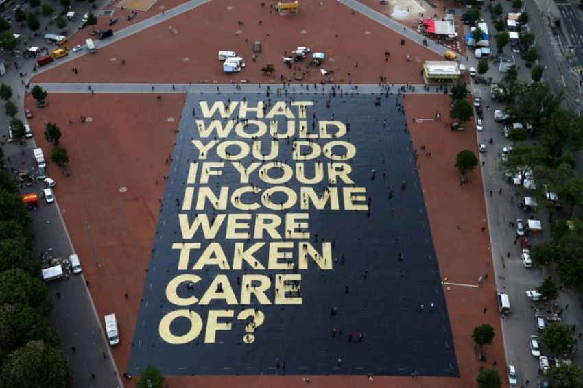 A large poster in a square in Geneva, Switzerland, promoting the idea of a universal basic income.