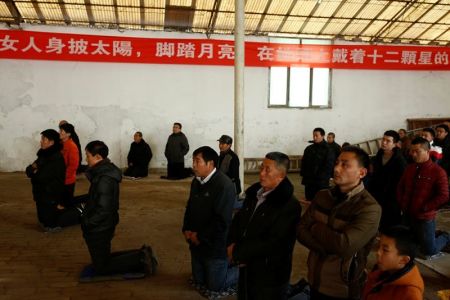 People attend Sunday service at a makeshift, tin-roofed church in Youtong village, China, December 11, 2016.
