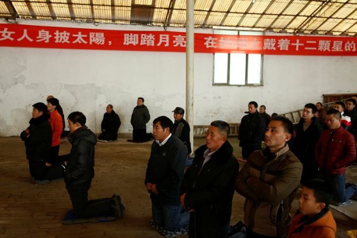 People attend Sunday service at a makeshift, tin-roofed church in Youtong village, China, December 11, 2016.