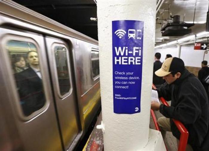 A sign advertises Wi-Fi service in the Times Square Subway station in New York, April 25, 2013.