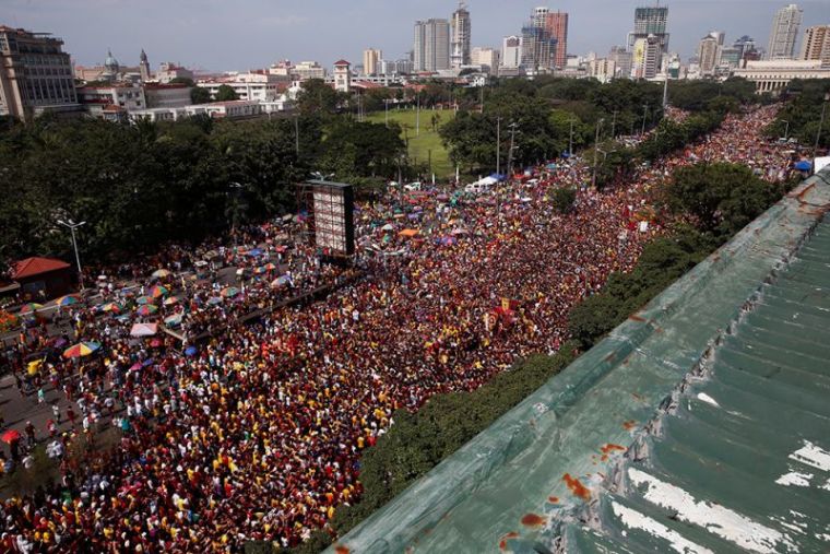 Devotees parade the black statue of Jesus Christ during the annual Black Nazarene Catholic religious feast in Manila, Philippines, January 9, 2017.