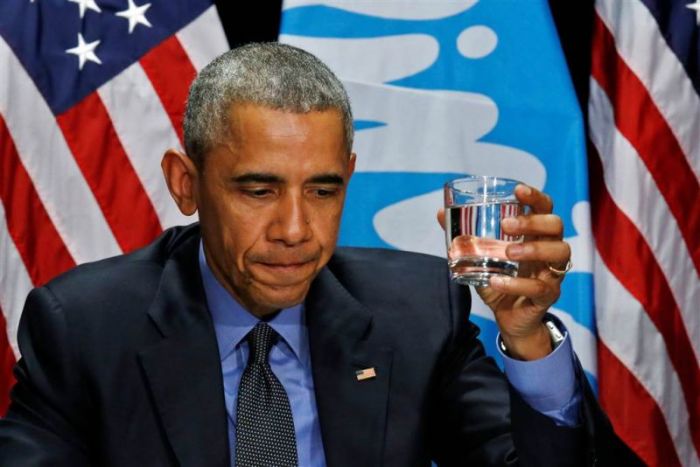 President Obama drinks a glass of filtered water from Flint, Michigan, a city struggling with the effects of lead-poisoned drinking water, during a meeting with local and federal authorities on May 4, 2016.