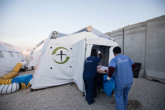 Doctors and medical professionals at Samaritan's Purse's field hospital outside of Mosul, Iraq work to save the life of a patient wounded in the fight against the Islamic State in January 2017.