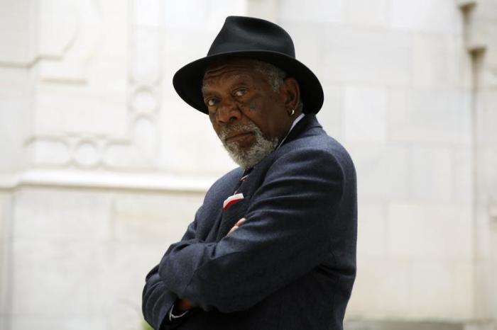 Morgan Freeman looks back at the camera while standing outside of the Islamic Center in Washington, D.C.