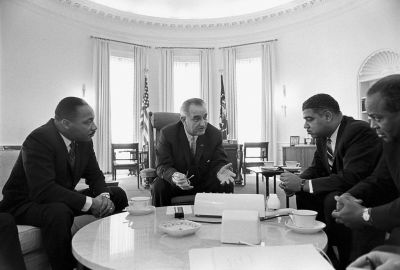 President Lyndon B. Johnson meets with Civil Rights leaders Martin Luther King, Jr., Whitney Young, James Farmer in the White House on January 18, 1964.