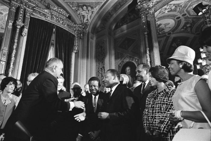 President Lyndon B. Johnson meets with Martin Luther King, Jr. at the signing of the Voting Rights Act of 1965
