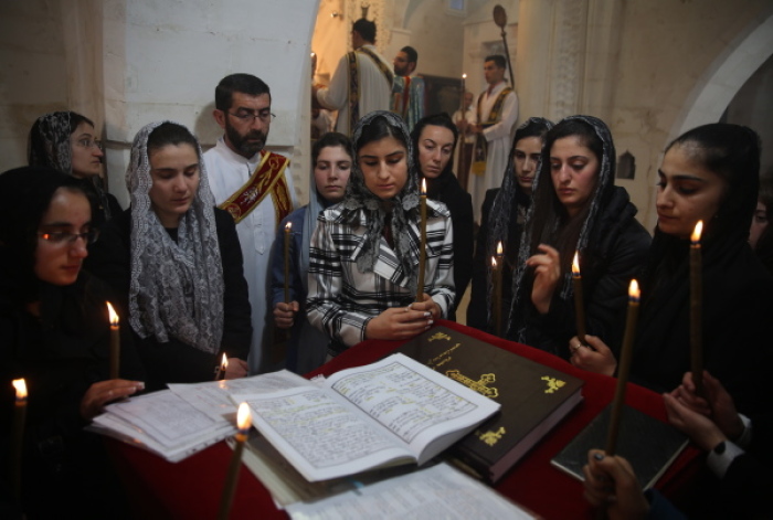 Syriac Christians from Turkey and Syria attend mass at Mort Shmuni Syriac Orthodox Church in Midyat on February 2, 2014.