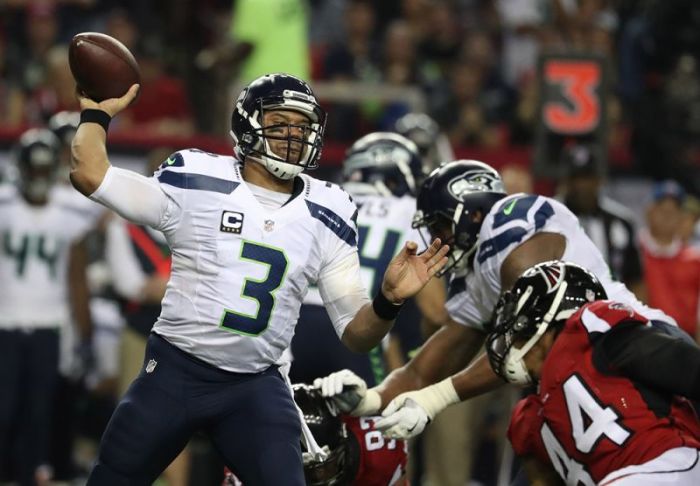 Seattle Seahawks quarterback Russell Wilson (3) throws against Atlanta Falcons outside linebacker Vic Beasley (44) during the second quarter in the NFC Divisional playoff at Georgia Dome in Atlanta, Georgia, January 14, 2017.