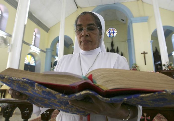 A nun reads the Bible during special prayers at the Church of Virgin Mary, the country's holiest Christian church which was captured by the military in June in the initial stage of the ongoing Vanni offensive against Tamil Tiger rebels, in Madhu, northern Sri Lanka, November 7, 2008.