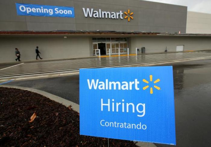 FILE PHOTO - Job postings are shown outside a new Walmart Super Center as the company opens its first store in Compton, California, U.S. on January 10, 2017.