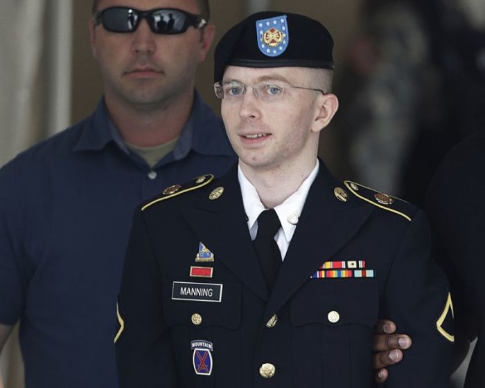 U.S. Army Private First Class Bradley Manning (C) departs the courthouse at Fort Meade, Maryland, July 30, 2013.