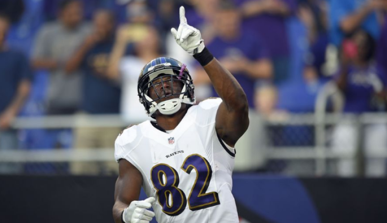 Baltimore Ravens tight end Benjamin Watson points to the sky during an NFL pre-season game in this undated file photo from 2016.