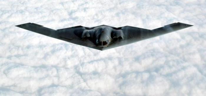 File: The B-2 Spirit stealth bomber flies over the Missouri Sky after taking off from the Whiteman Air Force Base in Johnson County, Missouri, October 30, 2002.