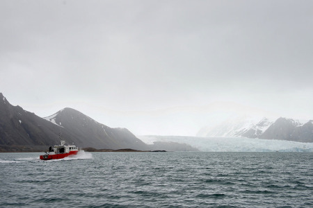 The research vessel "Teisten," carrying U.S. Secretary of State John Kerry and Norwegian Foreign Minister Borge Brende, cuts through the Kongsfjorden in Ny-Alesund, Norway, the northernmost civilian settlement in the world, en route to the Blomstrand Glacier so the two leaders could see the effects of global warming on the Arctic environment on June 16, 2016.