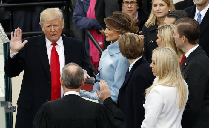 US President Donald Trump takes the oath of office with his wife Melania, and children Barron, Donald Jr., Eric, Ivanka and Tiffany at his side, during his inauguration at the U.S. Capitol in Washington, U.S., January 20, 2017.