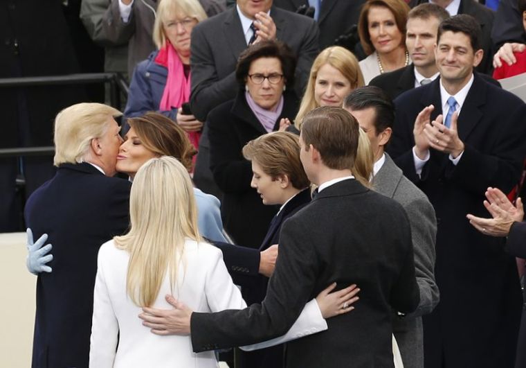 Donald Trump kisses his wife Melania after being sworn in as the 45th president of the United States on the West front of the U.S. Capitol in Washington, U.S., January 20, 2017.