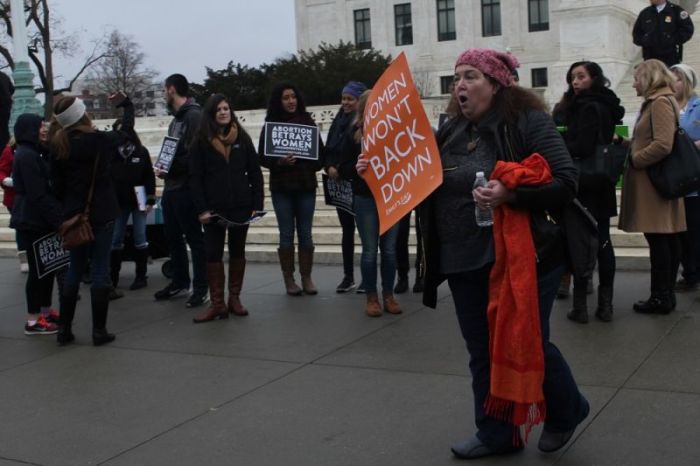 Maryland resident Michele Mulholland France shouts down pro-life students affiliated with Students for Life of America outside the United States Supreme Court building before the start of the Women's March in Washington on Jan. 21, 2017.