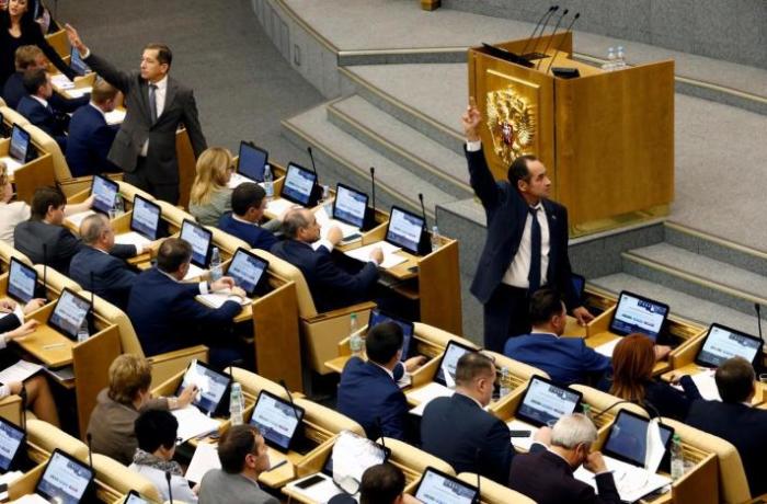 File: Deputies vote during a session at the State Duma, the lower house of parliament, in Moscow, Russia October 19, 2016.
