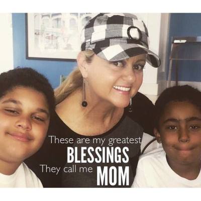 Vicki Yohe poses for a mother's day photo with her two sons, 2016.