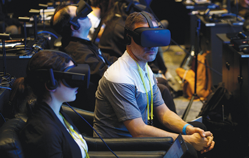 Showgoers wear Oculus Rift virtual reality headsets during the Intel press conference at CES in Las Vegas, January 4, 2017.
