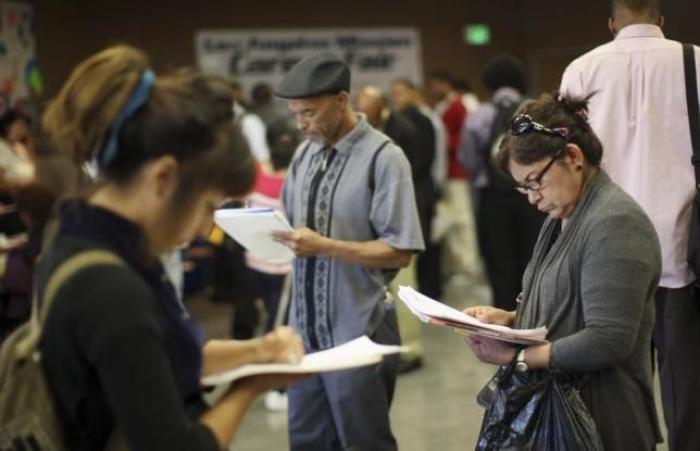 File Photo: Job seekers fill out applications during the 11th annual Skid Row Career Fair the Los Angeles Mission in Los Angeles, California, U.S. on May 31, 2012.