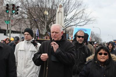 Catholics from the St. Athanasius Roman Catholic Church in Vienna, Virginia hold up the statue of Our Lady of Fatima while praying the Rosary at the March for Life in Washington, D.C. on Jan. 27, 2017.