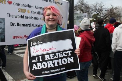 Breann Quigley or Reading, Pennsylvania holds up a sign as she participates in the March for Life in Washington, D.C. on Jan. 27, 2017.