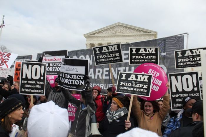 Pro-lifers stand in front of pro-choice protesters at the March for Life in Washington, D.C. on Jan. 27, 2017.