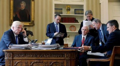 U.S. President Donald Trump (L-R), joined by Chief of Staff Reince Priebus, Vice President Mike Pence, senior advisor Steve Bannon, Communications Director Sean Spicer and National Security Advisor Michael Flynn, speaks by phone with Russia's President Vladimir Putin in the Oval Office at the White House in Washington, U.S. January 28, 2017.