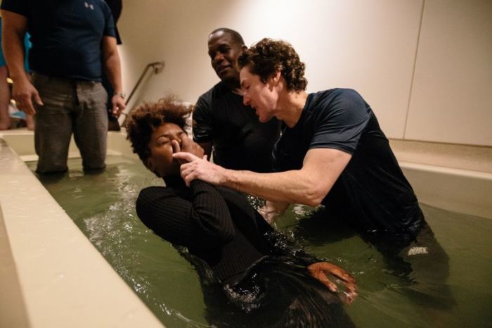 Joel Osteen performing baptisms at Lakewood Church in Houston, Texas, January 2017.