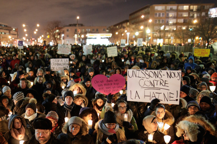 People attend a vigil in support of the Muslim community in Montreal, Quebec, January 30, 2017.