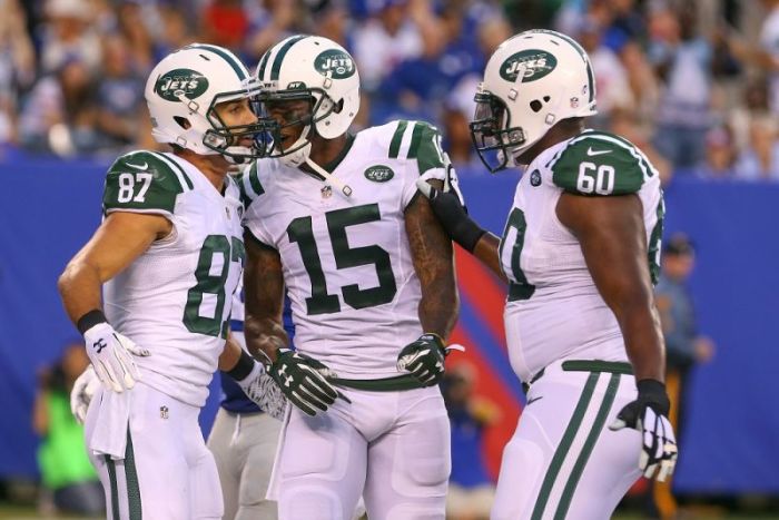 New York Jets wide receiver Eric Decker (87), New York Jets wide receiver Brandon Marshall (15) and New York Jets offensive tackle D'Brickashaw Ferguson (60) celebrate Decker's touchdown catch during the first half of their game against the New York Giants at MetLife Stadium on Aug 29, 2015 in East Rutherford, New Jersey.