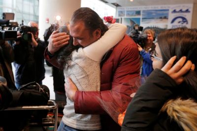 Banah Alhanfy is greeted by her uncle (R) at Logan Airport after she cleared U.S. customs and immigration on special immigrant visa in Boston, Massachusetts, U.S. February 3, 2017.