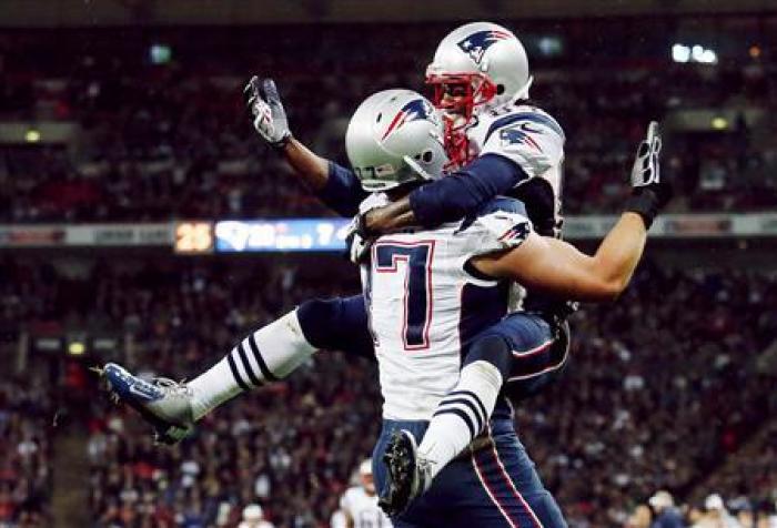 New England Patriots OT Nate Solder (L) celebrates teammate Brandon Lloyd (R) touchdown.